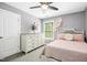 Charming bedroom featuring a beautiful dresser, stylish decor, and a comfortable bed at 44 S Wilders Ridge Way, Clayton, NC 27527