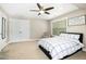 Comfortable bedroom with a ceiling fan, natural light, and neutral tones at 44 S Wilders Ridge Way, Clayton, NC 27527