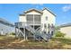 View of house featuring a deck and screened porch at 44 S Wilders Ridge Way, Clayton, NC 27527