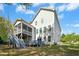 Rear view of the house with the outdoor living spaces and backyard at 44 S Wilders Ridge Way, Clayton, NC 27527