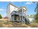 Rear exterior of the house with a deck and screened porch at 44 S Wilders Ridge Way, Clayton, NC 27527