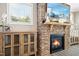 Close-up of a stone fireplace with rustic mantel and custom built-in cabinets at 44 S Wilders Ridge Way, Clayton, NC 27527