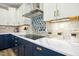 Gourmet kitchen with stainless steel appliances, custom backsplash, and quartz countertops at 44 S Wilders Ridge Way, Clayton, NC 27527