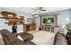 Stylish living room featuring a wet bar, large TV, and comfortable seating at 44 S Wilders Ridge Way, Clayton, NC 27527