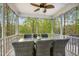 Enclosed porch with a dining table, chairs, and a ceiling fan at 44 S Wilders Ridge Way, Clayton, NC 27527