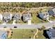 Aerial view of the home and neighborhood, nestled among lush greenery and well maintained roads at 490 Boulder Point Dr, Chapel Hill, NC 27516