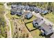 An aerial view showcases lush yards and homes with a walking trail nearby at 490 Boulder Point Dr, Chapel Hill, NC 27516