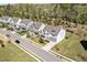Aerial view of a lovely home in a well-maintained neighborhood with mature trees and landscaping at 490 Boulder Point Dr, Chapel Hill, NC 27516