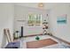 Bright bedroom with a large window, yoga mat, decorative shelves, and stylish accents at 490 Boulder Point Dr, Chapel Hill, NC 27516