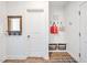 Functional entryway with coat hooks, built-in bench, and storage baskets, blending style and practicality at 490 Boulder Point Dr, Chapel Hill, NC 27516
