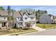 Angle view of a well-manicured two-story home with grey siding and a two-car garage at 490 Boulder Point Dr, Chapel Hill, NC 27516