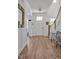 Bright foyer features hardwood floors, a white door, white trim, and wainscoting at 490 Boulder Point Dr, Chapel Hill, NC 27516