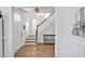 Bright foyer with hardwood floors, a staircase, and white wainscoting at 490 Boulder Point Dr, Chapel Hill, NC 27516