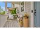 Inviting front porch with comfortable seating and decorative flower planters at 490 Boulder Point Dr, Chapel Hill, NC 27516
