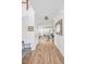 Hallway leading to living room with hardwood floors and a glimpse of a bright living area at 490 Boulder Point Dr, Chapel Hill, NC 27516
