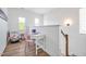 Upstairs hallway features wood floors, neutral paint, and a white desk with a pink chair at 490 Boulder Point Dr, Chapel Hill, NC 27516