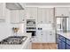 Well-equipped kitchen with stainless steel appliances and white cabinets at 490 Boulder Point Dr, Chapel Hill, NC 27516