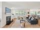 Bright living room with fireplace, shiplap accent wall, and plenty of natural light at 490 Boulder Point Dr, Chapel Hill, NC 27516