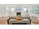 Spacious living room with fireplace, built-in cabinets, and a view of backyard at 490 Boulder Point Dr, Chapel Hill, NC 27516