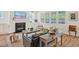 Open living room with fireplace, shiplap accent wall, and view of the dining area at 490 Boulder Point Dr, Chapel Hill, NC 27516
