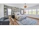 Stunning main bedroom featuring a decorative accent wall, a chandelier, and natural light at 490 Boulder Point Dr, Chapel Hill, NC 27516