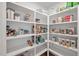 Well-organized pantry features white shelving and a variety of food items in clear containers at 490 Boulder Point Dr, Chapel Hill, NC 27516