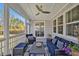 Relaxing screened porch with stylish furniture, ceiling fan, and a view of the outdoors at 490 Boulder Point Dr, Chapel Hill, NC 27516