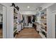 Walk-in closet featuring custom shelving and ample storage space for clothing and accessories at 490 Boulder Point Dr, Chapel Hill, NC 27516