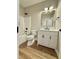 Bathroom with a modern vanity, mirror, and combination shower and tub at 50 Lakewood Dr, Roxboro, NC 27573