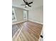 This bedroom features wood-look floors and two windows at 50 Lakewood Dr, Roxboro, NC 27573