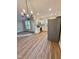 An inviting kitchen with modern appliances, white cabinets, and hardwood flooring, perfect for culinary adventures at 50 Lakewood Dr, Roxboro, NC 27573