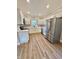 A modern kitchen featuring stainless steel appliances, white cabinets, and plenty of counter space at 50 Lakewood Dr, Roxboro, NC 27573