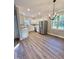 Bright kitchen featuring white cabinets, stainless steel appliances, and hardwood floors at 50 Lakewood Dr, Roxboro, NC 27573