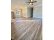 An open living space filled with natural light from the big windows and hardwood floors at 50 Lakewood Dr, Roxboro, NC 27573