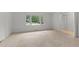 Spacious bedroom featuring neutral carpet, white walls, and an adjacent closet with bi-fold doors at 505 Forest Rd, Oxford, NC 27565