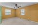 Bedroom with neutral carpet and mustard-colored walls at 505 Forest Rd, Oxford, NC 27565