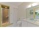 Bathroom featuring patterned wallpaper, a standing shower, and a vanity with a large mirror at 505 Forest Road Rd, Oxford, NC 27565