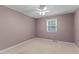 Bedroom featuring neutral walls, carpeted flooring, a window, and a ceiling fan at 505 Forest Road Rd, Oxford, NC 27565
