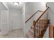 Welcoming home foyer with staircase and neutral flooring, creating a warm and inviting entrance at 505 Forest Road Rd, Oxford, NC 27565