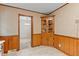 Corner of a charming kitchen with patterned wallpaper and built in wood cupboard and tile floors at 505 Forest Road Rd, Oxford, NC 27565