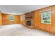 Spacious living room with wood paneling and a brick fireplace at 505 Forest Road Rd, Oxford, NC 27565
