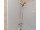 Close-up of a white tiled shower with a multi-setting shower head and chrome fixtures at 505 Forest Road Rd, Oxford, NC 27565