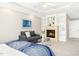 Cozy bedroom featuring a fireplace, built-in shelves, seating area and a stylish blue patterned bedspread at 507 Presque Isle Ln # Bldg 500, Chapel Hill, NC 27514