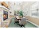 Bright conference room with stone fireplace and large windows, creating an inviting and professional atmosphere at 507 Presque Isle Ln # Bldg 500, Chapel Hill, NC 27514