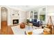 Cozy living room with a fireplace, hardwood floors, and comfortable seating arrangement at 507 Presque Isle Ln # Bldg 500, Chapel Hill, NC 27514