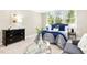 Stylish main bedroom includes a seating area, large windows, and tasteful decor at 507 Presque Isle Ln # Bldg 500, Chapel Hill, NC 27514