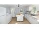 Functional kitchen with appliances, including refrigerator, washer and dryer and ample counter space at 509 N Elm St, Benson, NC 27504