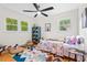 Bedroom with wood floors, a ceiling fan, an area rug and two windows offering great natural light at 513 Hugo St, Durham, NC 27704