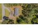 Aerial view of a home surrounded by trees, showcasing its secluded location and outdoor space at 5604 Bobcat Rd, Chapel Hill, NC 27516