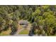 Aerial view of a home highlighting mature trees, driveway, and lush surroundings, providing privacy at 5604 Bobcat Rd, Chapel Hill, NC 27516